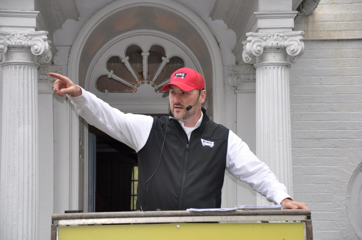 Jeff Kiko, of Kiko Auctions, conducts an auction at the former William H. Morgan Jr. mansion in Alliance. The house and 10 acres sold for $495,000.