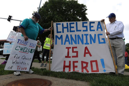 A woman takes part in a small rally in support of Chelsea Manning in Kansas City, Missouri, U.S. May 17, 2017. REUTERS/Carlo Allegri