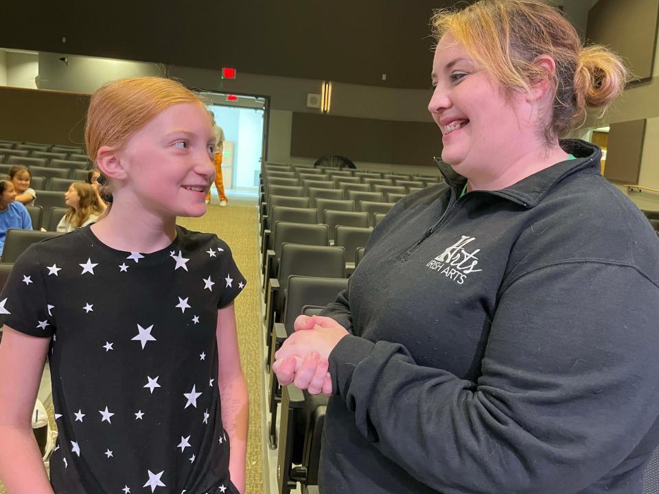 Lucy Shumaker gets a quick word from theater director Jessica Magers-Rankin at Irish Art Camp held at Knoxville Catholic High School on June 9, 2023.