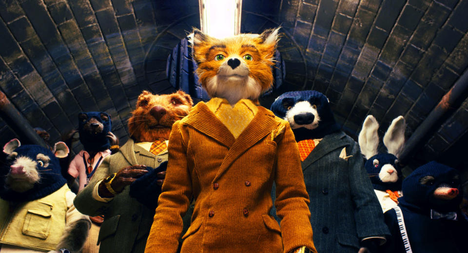 Mr. Fox, a stop animation character, and his cohorts walking through a tunnel