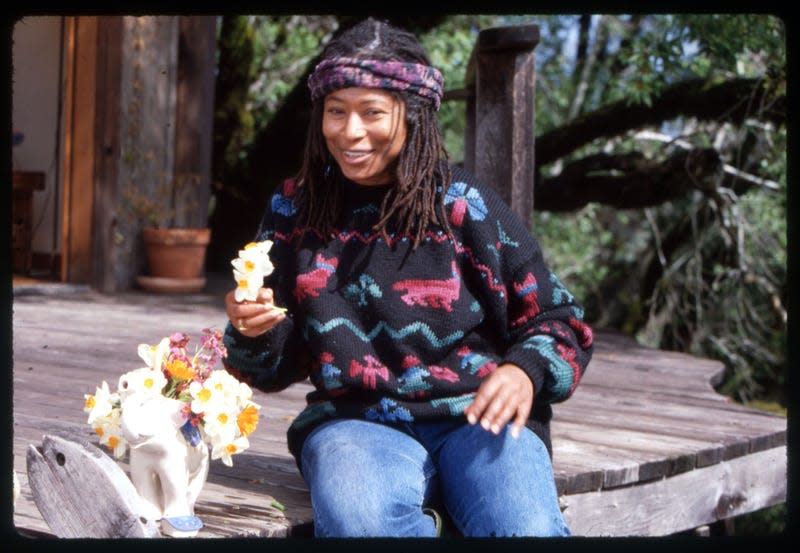 Portrait of American poet and author Alice Walker as she sits, with a pot (in the shape of an elephant) of flowers on per porch, San Francisco, California, 1989.