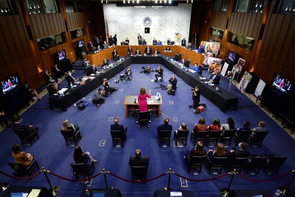 Supreme Court nominee Amy Coney Barrett is sworn in before the Senate Judiciary Committee on Monday.  