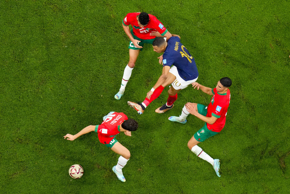 France's Kylian Mbappe attempts a shot on goal during the World Cup semifinal soccer match between France and Morocco at the Al Bayt Stadium in Al Khor, Qatar, Wednesday, Dec. 14, 2022. (AP Photo/Petr David Josek)