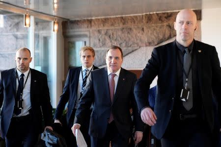 Swedish Prime Minister Stefan Lofven surrounded by security guards arrives at the meeting with the Speaker of the Parliament Andreas Norlen in Stockholm, Sweden January 14, 2019. TT News Agency TT News Agency/Anders Wiklund via REUTERS