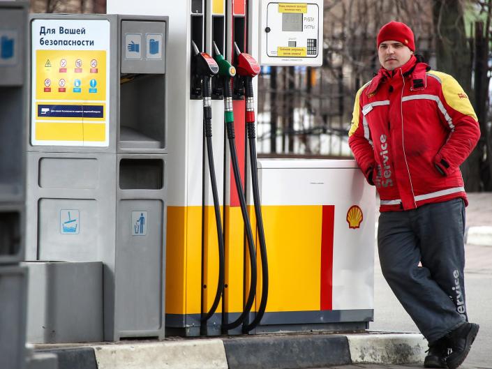 A worker at a Shell gas station in Leningradskoye Highway, Moscow, Russia.