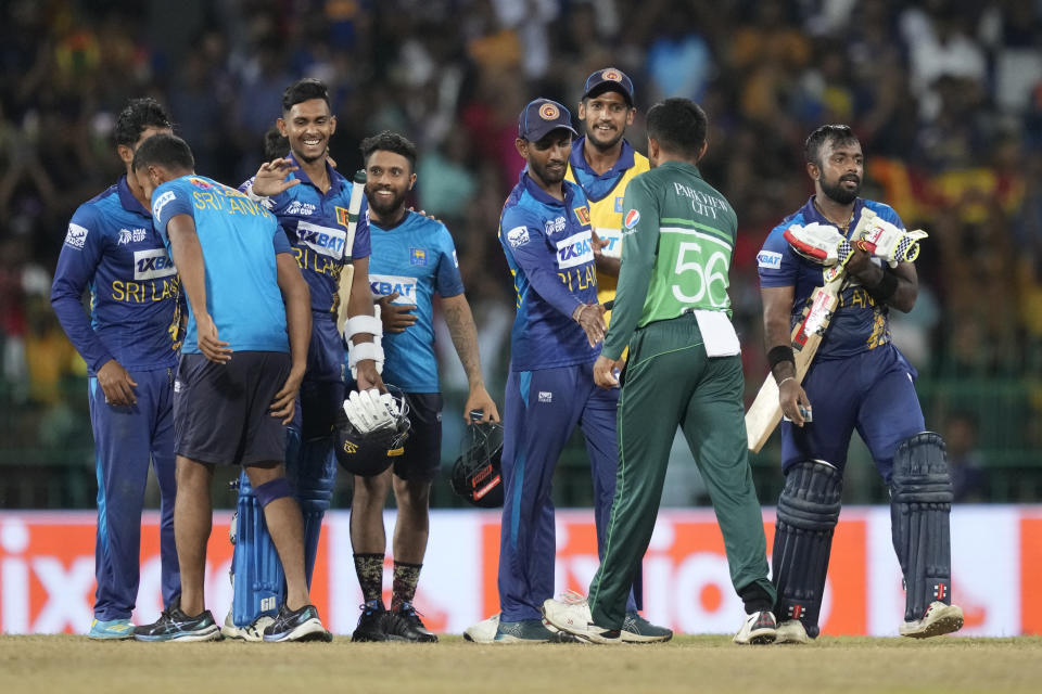 Sri Lankan team members celebrate their two wickets win in the Asia Cup cricket match between Pakistan and Sri Lanka in Colombo, Sri Lanka on Thursday, Sept.14, 2023. (AP Photo/Eranga Jayawardena)