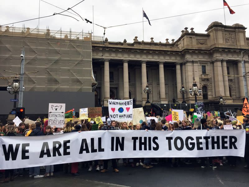 FILE PHOTO: People at a rally led by Extinction Rebellion, call for action on climate change, in Melbourne, Australia