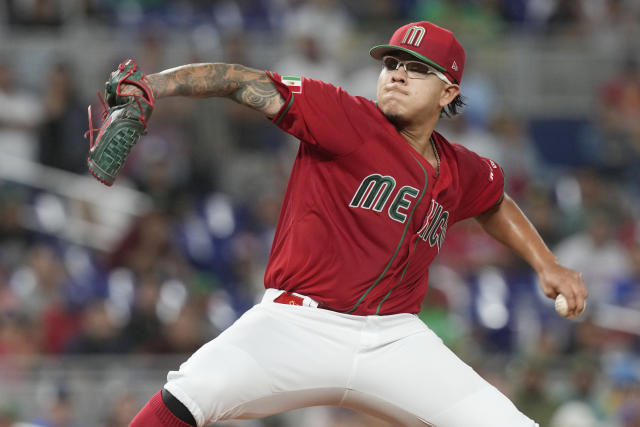 Mexico starting pitcher Julio Urias (7) aims a pitch during the first inning of a World Baseball Classic game against Puerto Rico, Friday, March 17, 2023, in Miami. (AP Photo/Marta Lavandier)