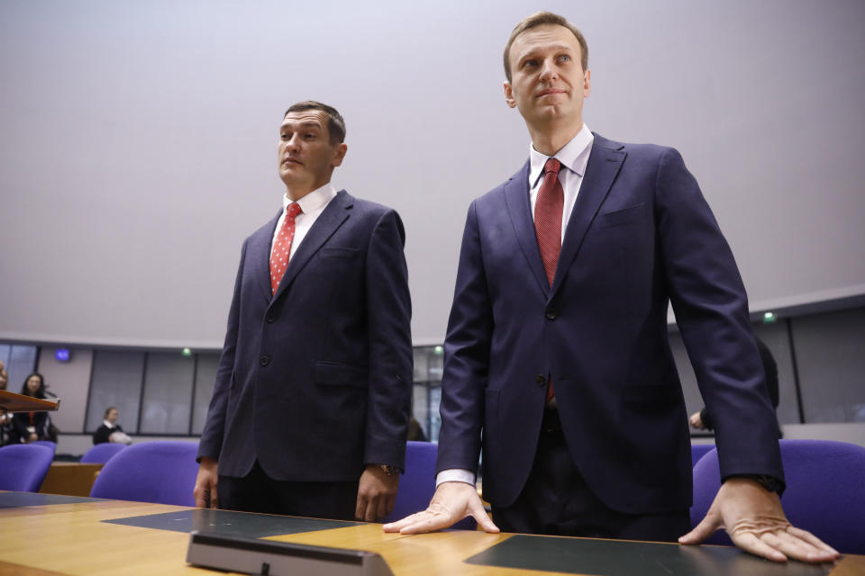 Russian opposition leader Alexei Navalny, right, and his brother Oleg stand during his hearing at the European Court of Human Rights in Strasbourg, eastern France, Thursday, Nov.15, 2018. Russia is awaiting the European court ruling on whether it violated the rights of Navalny when arresting him on repeated occasions. (AP Photo/Jean-Francois Badias)
