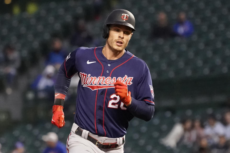 Minnesota Twins' Max Kepler rounds the bases after hitting a two-run home run off Chicago Cubs starting pitcher Kyle Hendricks during the first inning of a baseball game Wednesday, Sept. 22, 2021, in Chicago. (AP Photo/Charles Rex Arbogast)