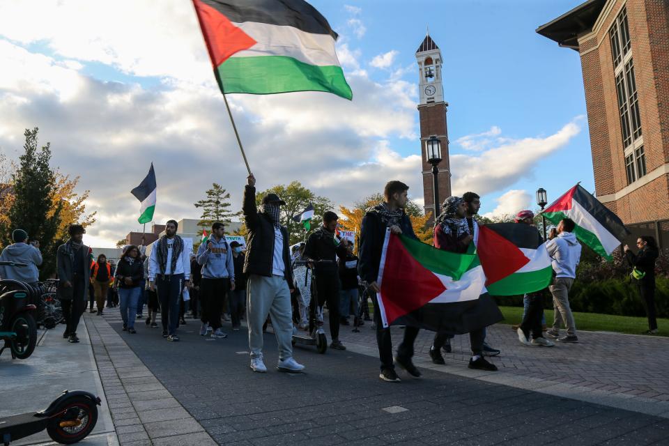 Demonstrators march on campus in response to the Palestinian and Israeli conflict, on Friday, Oct. 20, 2023, at Purdue University in West Lafayette, Ind.