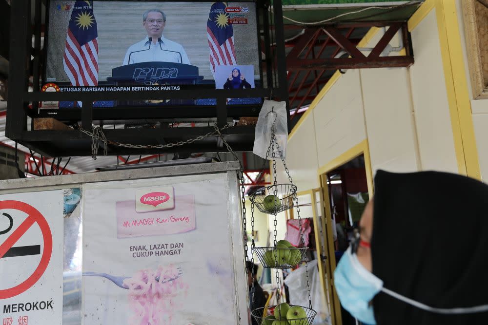 A live broadcast of Prime Minister Tan Sri Muhyiddin Yassin on the recovery movement control order is seen on a television in Kuala Lumpur June 7, 2020. ― Picture by Ahmad Zamzahuri