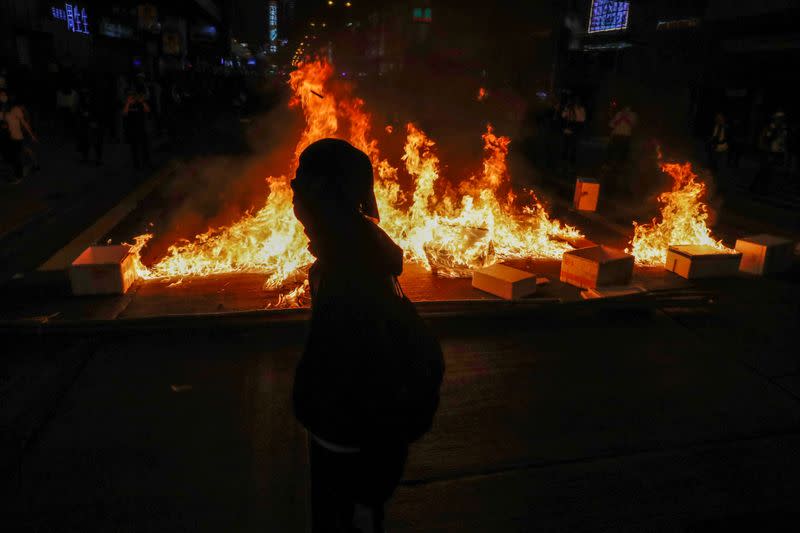 FILE PHOTO: Anti-government protesters burn objects during a protest at Mong Kok, in Hong Kong