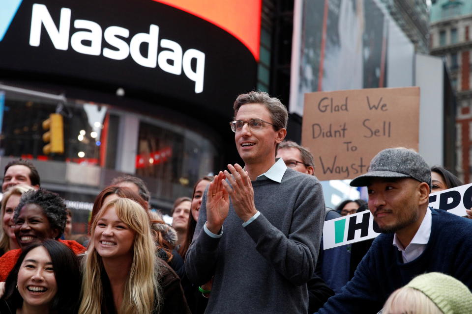 Jonah Peretti, founder and CEO of BuzzFeed, poses with employees to celebrate the company&#39;s debut outside the Nasdaq Market in Times Square in New York City, U.S., December 6, 2021.  REUTERS/Brendan McDermid