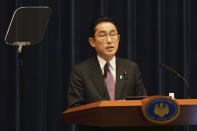 Japanese Prime Minister Fumio Kishida speaks during a news conference in Tokyo, Wednesday, March 16, 2022. Kishida on Wednesday announced plans to fully lift coronavirus restrictions on March 21 as new infections driven by the highly contagious omicron variant slow. (Stanislav Kogiku/Pool Photo via AP)