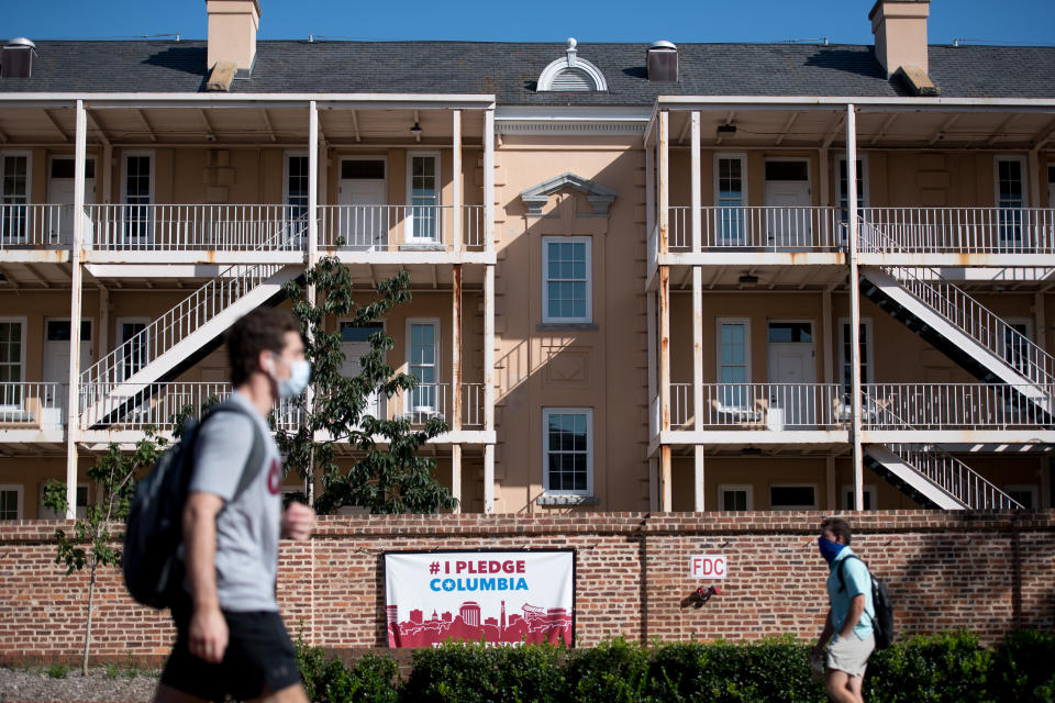 COLUMBIA, SC - SEPTEMBER 03: Students walk on campus at the University of South Carolina on September 3, 2020 in Columbia, South Carolina. During the final week of August the university reported a 26.6%  positivity rate among the student population tested for Covid-19. (Photo by Sean Rayford/Getty Images)