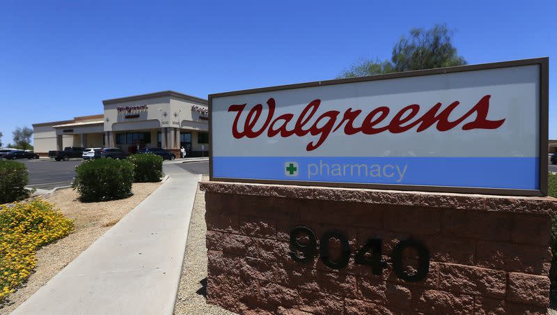 A Walgreens store is seen, June 25, 2018, in Peoria, Ariz. Some Walgreens pharmacy staff walked off the job this week over concerns that working conditions are putting employees and patients at risk.