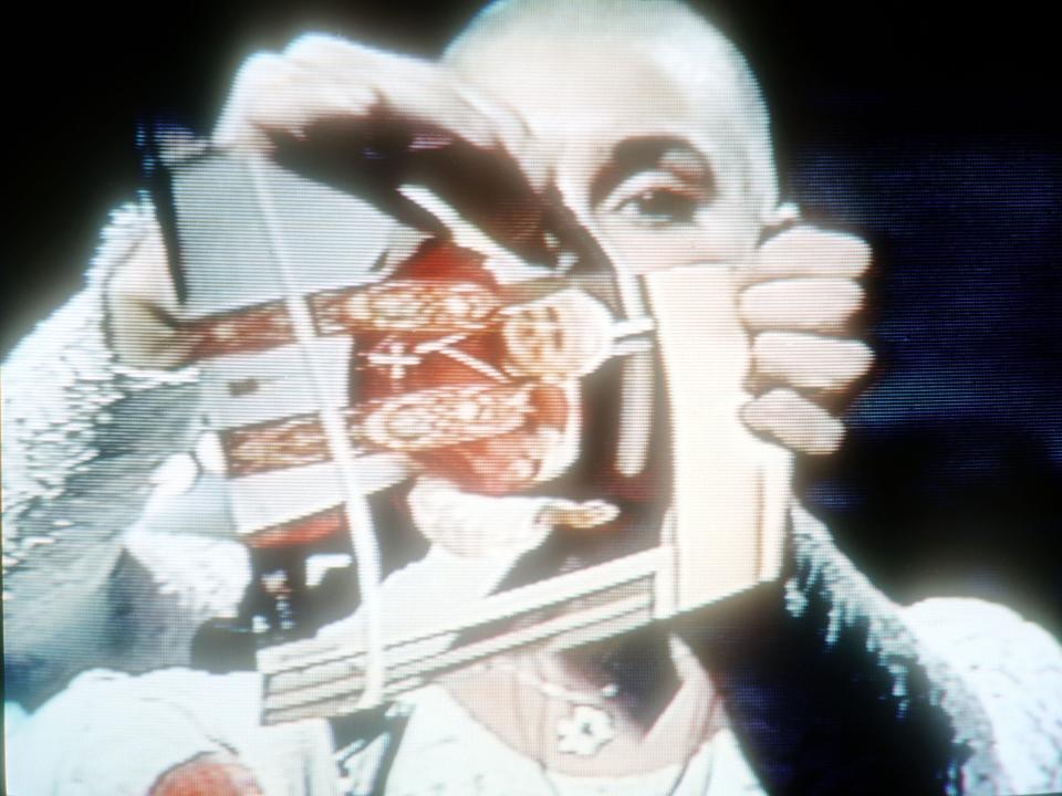 Singer Sinead O'Connor rips up a picture of Pope John Paul II October 3, 1992 on the TV show "Saturday Night Live".