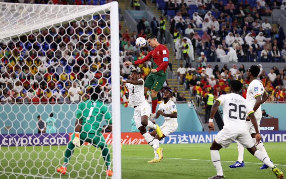 Cristiano Ronaldo of Portugal competes for a header against Mohammed Salisu of Ghana during the FIFA World Cup Qatar 2022 Group H match between Portugal and Ghana - Julian Finney/Getty Images