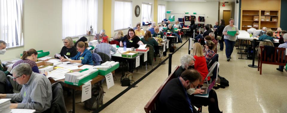 Ballots are counted at the Central Count as election observers watch the process at Green Bay City Hall on Nov. 8, 2022 in Green Bay, Wis.