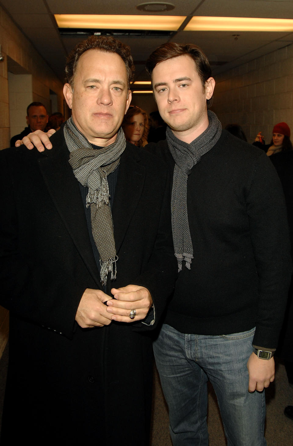 Colin Hanks with his arm around Tom Hanks