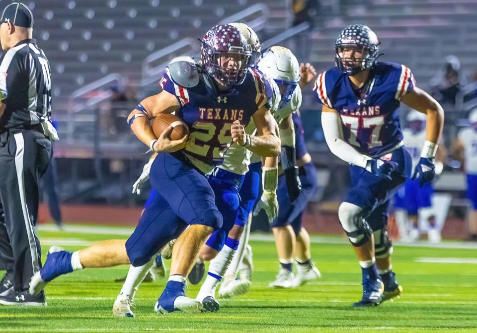 Wimberley running back Johnny Ball gallops downfield for a touchdown against Lago Vista during the teams' Class 4A Division II Region IV championship game Friday at Hutto Memorial Stadium. Ball's 303 rushing yards paced the Texans' 49-30 win.