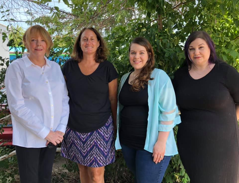 The past and current executive directors of READ Ottawa. From left: Sherry Mitchell (2008-2012), Susan Lowe (2013-2018), Hannah Everett (2018-2021) and Stormie Drake (2021-present).