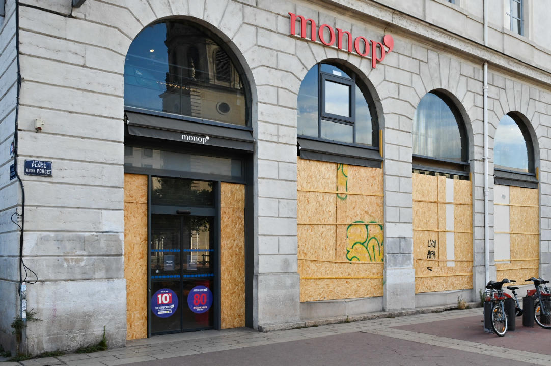 The windows of the MONOPRIX store are protected by wooden plates in anticipation of a demonstration in reaction to the results of the second round of the French legislative elections on July 7, so that demonstrators and thugs can t break them, in Lyon, France, on July 7, 2024. (Photo by Matthieu Delaty / Hans Lucas / Hans Lucas via AFP) (Photo by MATTHIEU DELATY/Hans Lucas/AFP via Getty Images)