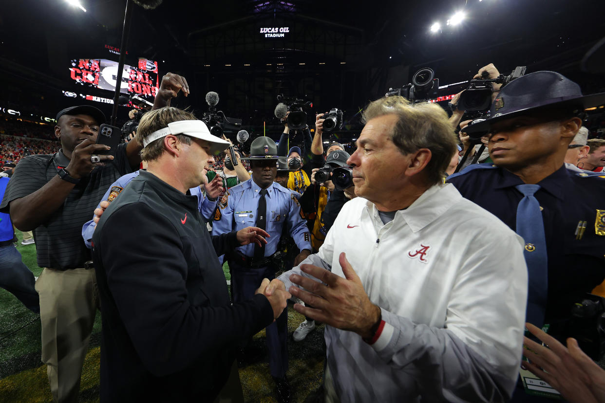 Alabama head coach Nick Saban, right, will lead one of the most talented rosters in college football this season with hopes of taking down the defending national champion Georgia Bulldogs and their head coach Kirby Smart, left. (Photo by Kevin C. Cox/Getty Images)