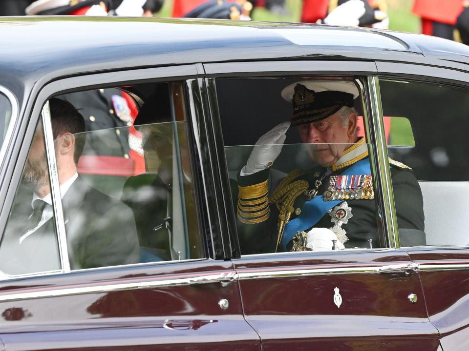 King Charles III drives past Wellington Arch during the State Funeral of Queen Elizabeth II on September 19, 2022 in London, England.