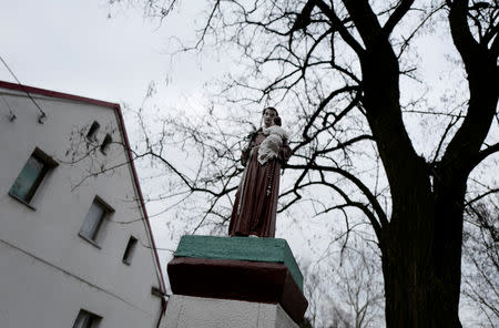 A holy statue is seen in front of the parish house near the Church of Saint Jacob in Ostrowite village, Poland February 17, 2019. Picture taken February 17, 2019. REUTERS/Kacper Pempel