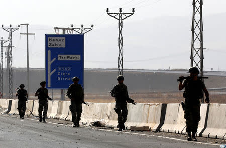 Turkish soldiers patrol the main road leading to the Habur border gate near the town of Silopi at the Turkish-Iraqi border, Turkey, September 22, 2017. REUTERS/Umit Bektas