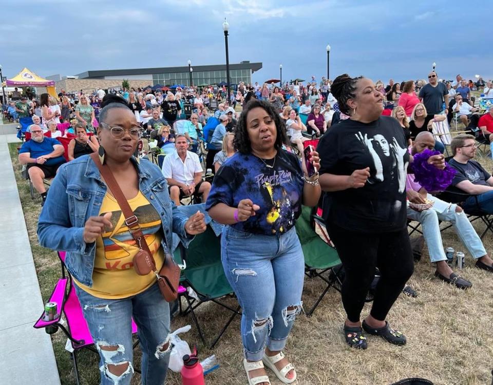 Members of the crowd dance on Saturday night during the Prince tribute concert at the Jackson Amphitheater. Tribute acts playing music of the '80s have been especially popular at the venue, which opened last summer.