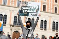 Demonstrators protest against restrictive measures put in place to fight COVID-19, in Rome