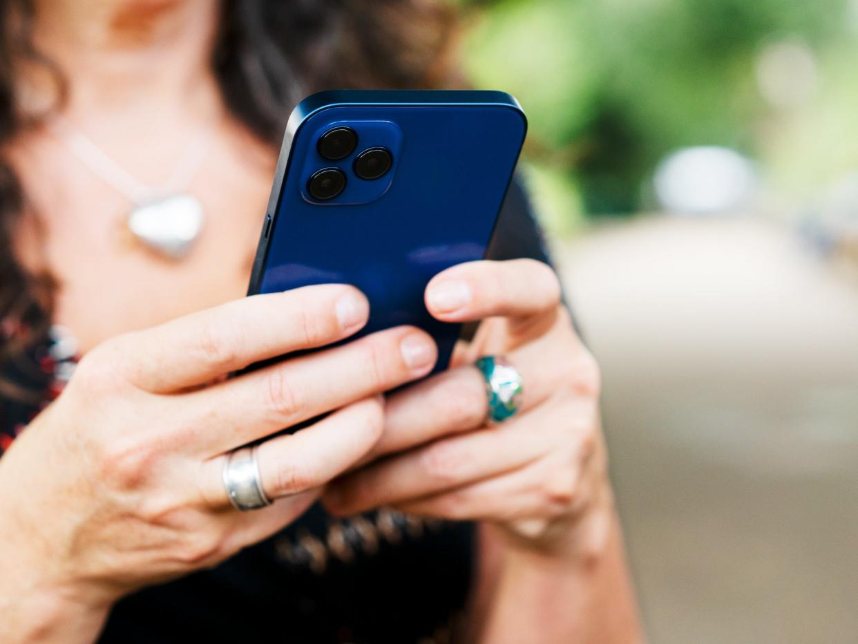 Close up of woman with smart phone