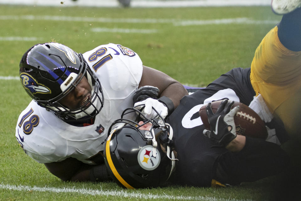 Pittsburgh Steelers quarterback Kenny Pickett (8) is tackled by Baltimore Ravens linebacker Roquan Smith (18) during the first half of an NFL football game in Pittsburgh, Sunday, Dec. 11, 2022. Picket left the game under concussion protocol. (AP Photo/Fred Vuich)