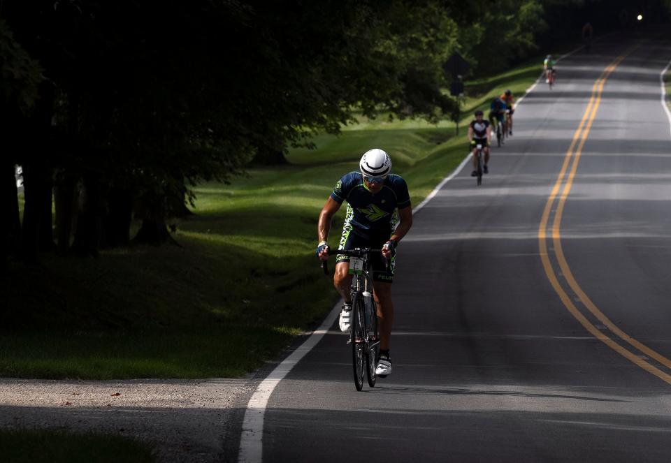 Aug 5, 2023; Columbus, Ohio, U.S.;  Pelotonia riders on Kitzmiller Road in New Albany on the fifteenth year of the Pelotonia ride to fund cancer research. 