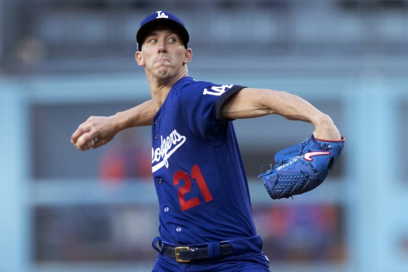Los Angeles Dodgers starting pitcher Walker Buehler throws to a New York Mets batter.