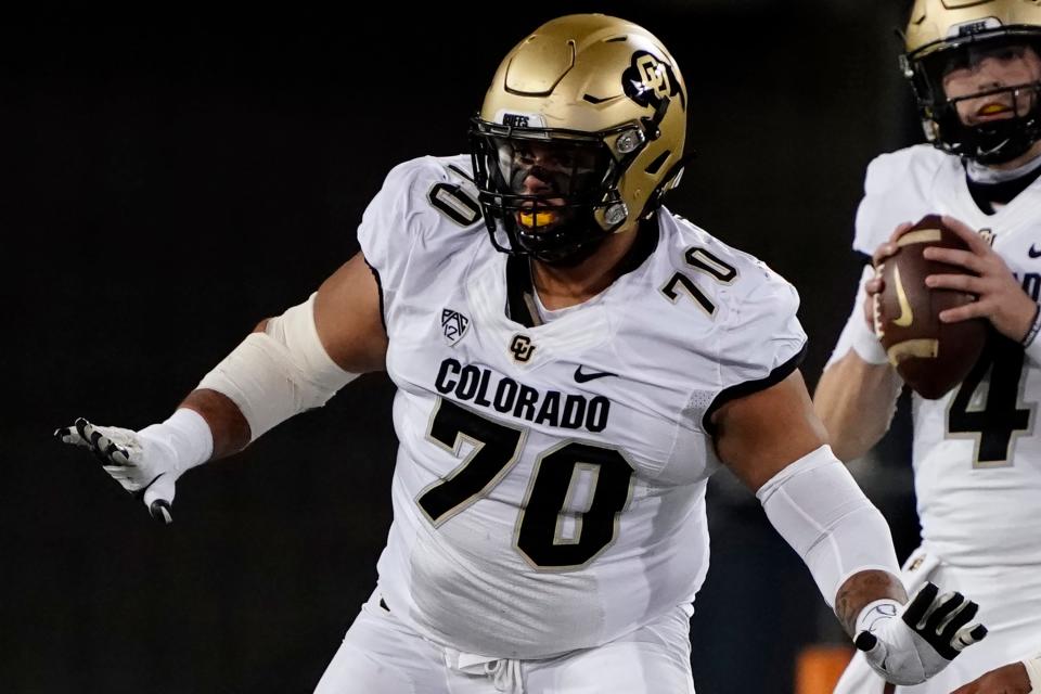 FILE - Colorado offensive lineman Casey Roddick (70) plays in the first half during an NCAA college football game against Arizona, Saturday, Dec. 5, 2020, in Tucson, Ariz. Colorado offensive lineman Casey Roddick nearly had his football career ended after a case of COVID-19 developed into a serious bout with myocarditis, an inflammation of the heart wall. These days, the left guard from California doesn't take even one snap for granted. That's why he relished his new role as team captain. (AP Photo/Rick Scuteri, File)