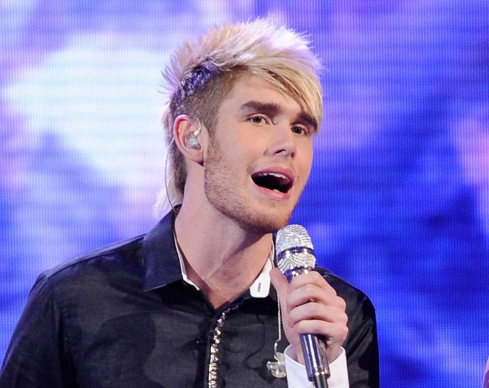 FILE - In this April 11, 2012 file photo released by Fox, Colton Dixon performs on the singing competition series "American Idol," in Los Angeles. The 20-year-old alt-rocker was revealed Thursday, April 19, 2012 to have received the fewest viewer votes on the Fox talent competition. Dixon was surprisingly eliminated from "Idol" after delivering lukewarm renditions of Lady Gaga's "Bad Romance" and Earth Wind and Fire's "September" on Wednesday's evening of old and new tunes. (AP Photo/Fox, Michael Becker, File)
