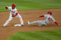 St Louis Cardinals Tommy Edmann is out at second as Philadelphia Phillies second baseman Jean Segura throws to first for a double play during the first inning of a baseball game Friday, April 16, 2021, in Philadelphia. (AP Photo/Laurence Kesterson)