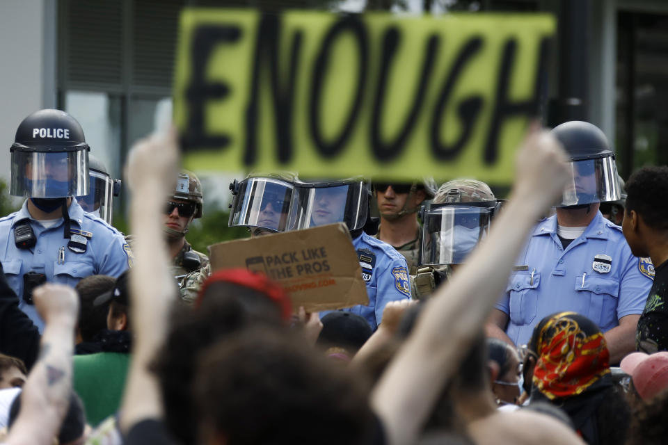 FILE - In this June 1, 2020, file photo, protesters rally as Philadelphia Police officers and Pennsylvania National Guard soldiers look on in Philadelphia, over the death of George Floyd, a black man who was in police custody in Minneapolis. (AP Photo/Matt Slocum, File)
