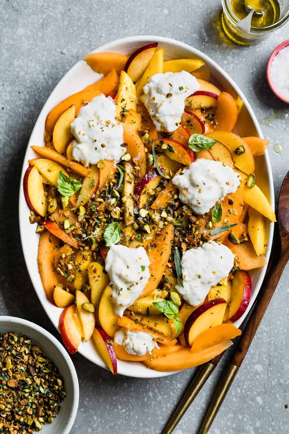 <p>Proof that you don't need lettuce to create a delicious and relatively healthy vegetarian side dish. </p><p><a href="https://www.snixykitchen.com/summer-fruit-salad-with-herbed-pistachio-crumble/" rel="nofollow noopener" target="_blank" data-ylk="slk:Get the recipe." class="link ">Get the recipe. </a></p>