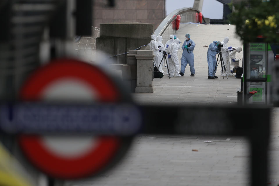 Police forensic officers work on London Bridge.&nbsp;