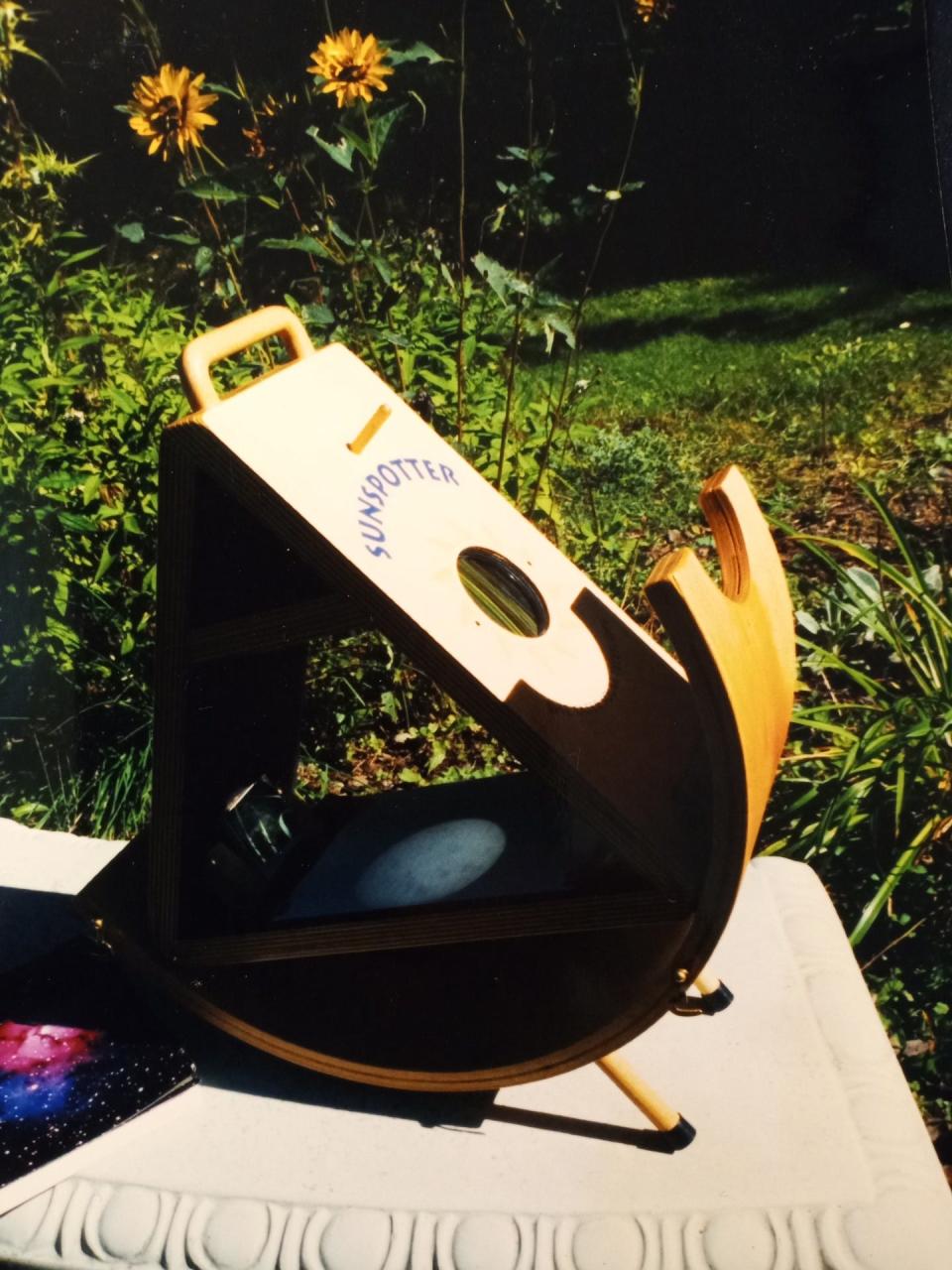 A Massachusetts-based science education supply firm acquired the patent for the Sunspotter after the inventor, Daniel R. Janosik, Sr., died in 1995. The company improved on the design and added the wooden cradle to support it, shown here. The Sunspotter, an easy way to track sunspots on any sunny day and to see a solar eclipse, is now sold by numerous companies nationwide.