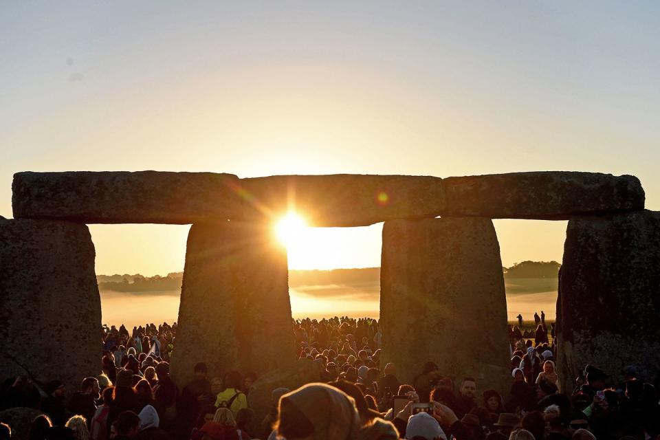 <p>Finnbarr Webster/Getty</p> Summer solstice at Stonehenge