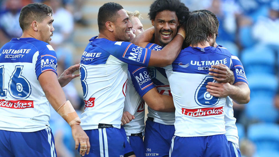 Jayden Okunbor of the Bulldogs celebrates a try during the round 10 NRL match between the Gold Coast Titans and the Canterbury Bulldogs at Cbus Super Stadium on May 18, 2019 in Gold Coast, Australia. (Photo by Chris Hyde/Getty Images)