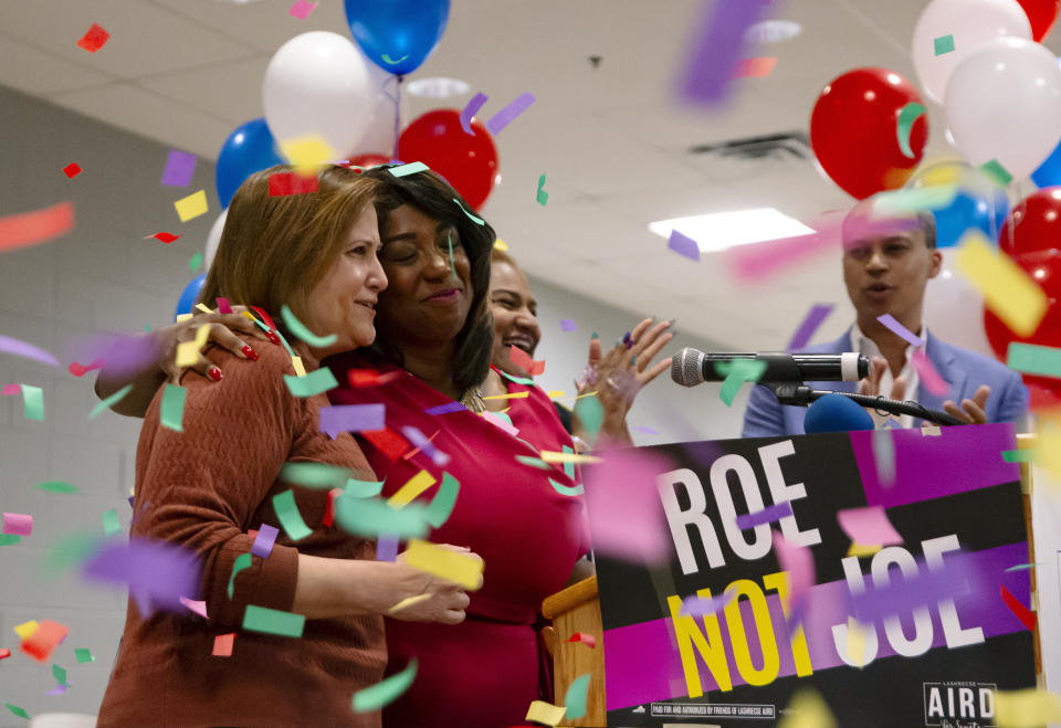 State Sen. Ghazala Hashmi, left, and Lashrecse Aird hug after Aird's victory speech during an election night party at the IBEW Local 666 in Highland Springs, Va., Tuesday, June 20 2023. Former state legislator Aird defeated incumbent and self-described “pro-life” Democrat Sen. Joe Morrissey in a closely watched primary election nomination contest that centered on abortion rights. (Nicolas Galindo/Richmond Times-Dispatch via AP)