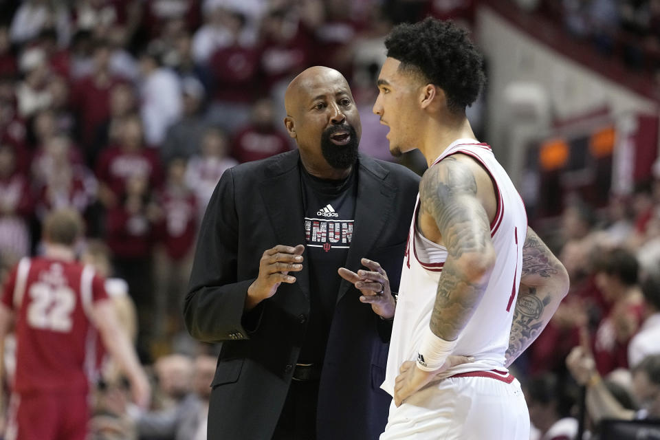 Indiana head coach Mike Woodson talks with Jalen Hood-Schifino during the second half of an NCAA college basketball game against Wisconsin, Saturday, Jan. 14, 2023, in Bloomington, Ind. (AP Photo/Darron Cummings)