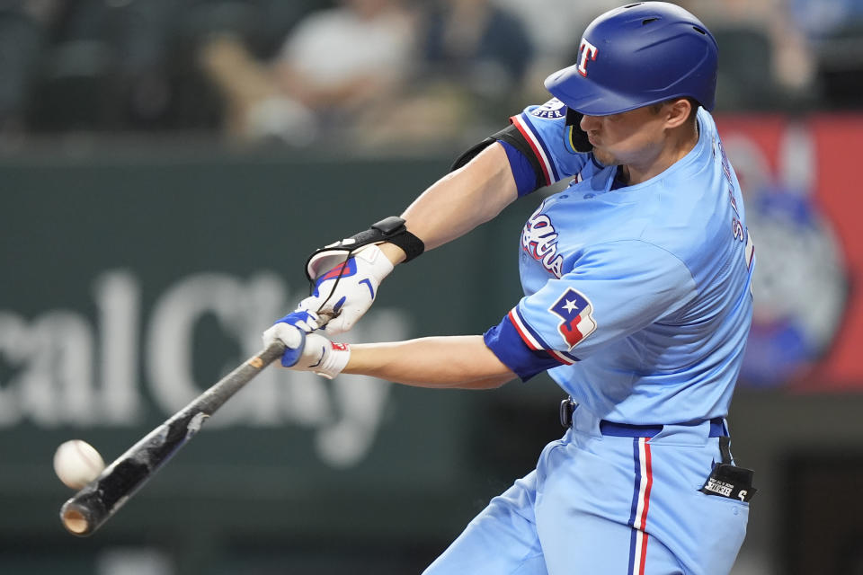 Texas Rangers' Corey Seager hits a home run during the fourth inning of a baseball game against the Los Angeles Angels in Arlington, Texas, Sunday, May 19, 2024. (AP Photo/LM Otero)